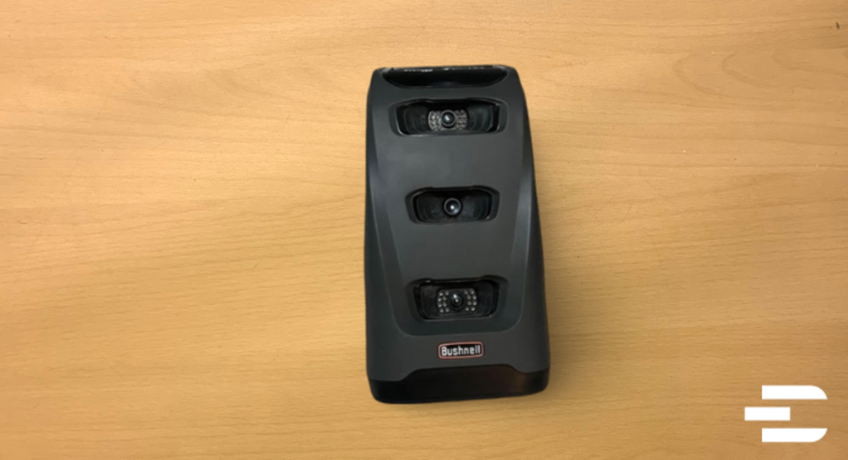 Bushnell Launch Pro laying flat on a table with three visible tracking cameras