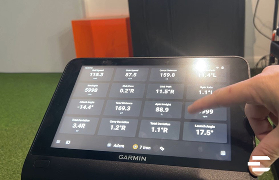 Garmin Approach R50 displaying full-screen shot data metrics including spin rate, carry distance, launch angle, and club path for a 7 iron.