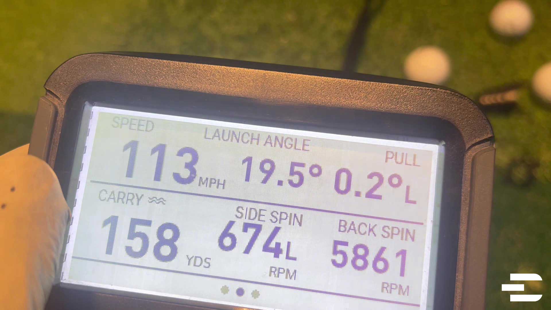 Bushnell Launch Pro screen showing shot data including speed, launch angle, spin, and carry distance.